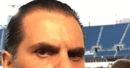 Christian Martinoli in a press box, focused, showcasing his passion for Mexican football commentary and sports journalism.
