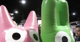 Colorful inflatable Hoops and Yoyo characters at a lively event, appealing to fans and collectors of animated fun.