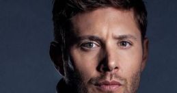 Jensen Ackles poses confidently in a stylish leather jacket, showcasing his captivating features and intense gaze.