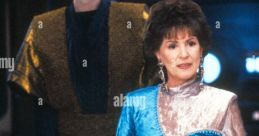 Majel Barrett as a key character in Star Trek Generations, featuring her iconic blue and silver costume with futuristic technology.