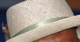 Ving Rhames smiling in a stylish hat, known for his voice as the Arby's narrator, exuding charisma and charm.