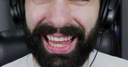 Orazio Grinzosi laughs joyfully in a gaming setup, embodying the energetic style of ZEB89.