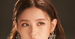 G-IDLE Miyeon showcases elegance with stunning jewelry and a detailed outfit, captivating fans in this striking portrait.