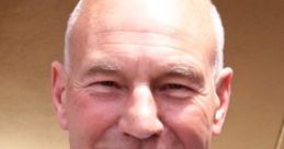 Smiling Patrick Stewart as Jean-Luc Picard, wearing his iconic Starfleet uniform from Star Trek: The Next Generation.