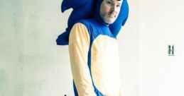 Person dressed as Sonic the Hedgehog in a blue costume, capturing a playful homage to the iconic video game character.