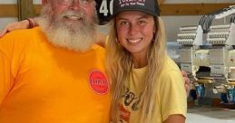 Haliey Welch poses with a friend wearing a "Hawk Tuah 24" cap, showcasing a casual and friendly atmosphere.