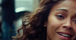 Emotional moment from "Infinitely Polar Bear" trailer featuring a woman expressing warmth and connection amidst a busy backdrop.
