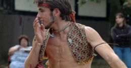 Energetic performer in vibrant costume, embodying the spirit of a Crazy Psychic Gypsy Man at a lively outdoor festival.