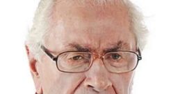 Frowning elderly man with glasses, showcasing an intense expression, often associated with the "Angry Hull Man" meme.