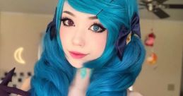 Emiru cosplay featuring vibrant blue hair, striking eyes, and elegant gloves, embodying the character's unique style.
