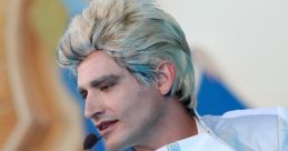 Performer in sleek silver costume showcases talent in Hollywood Factory's "Power of Surge Vol. 1," captivating the audience.