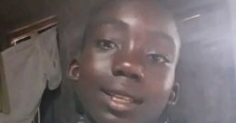 Smiling boy wearing a light blue t-shirt, showcasing a joyful moment related to Buddy DML AEDTP WORLD activities.