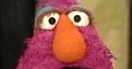 Telly Monster, a beloved character from Sesame Street, with vibrant purple fur and a playful expression.