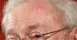 Michael Caine smiling at an event, showcasing his iconic glasses and charm. A legendary figure in cinema history.