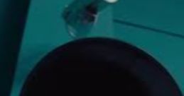 Black speaker used by the Squid Game Announcer Lady, set against a teal background, enhancing the show's tense atmosphere.