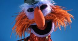 Floyd Pepper, the colorful Muppet, strums a guitar, showcasing his vibrant personality and musical talent.
