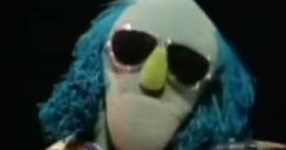 Zoot, the Muppet saxophonist, showcases his jazzy style with shades and vibrant blue hair, performing on stage.