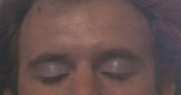 Close-up of a young man with closed eyes, evoking the soulful essence of "Love Is Alive" by Gary Wright.