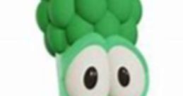 Playful green character with a smiling face and broccoli-like features, representing Junior Asparagus from VeggieTales.