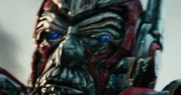 Close-up of Sentinel Prime from Transformers 3: Dark of the Moon, showcasing his intricate armor and blue eyes.