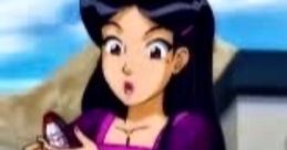 Mandy from Totally Spies! shows surprise while examining a gadget outside in a vibrant, animated scene.
