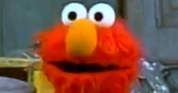 Elmo, the beloved red character from Sesame Street, playfully engages viewers with his iconic expression and charm.