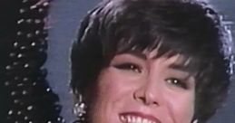 Michelle Wright smiles brightly, showcasing her signature style with floral embellishments and bold earrings on stage.