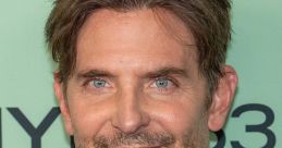 Bradley Cooper smiles confidently at a recent event, showcasing his signature style and charismatic presence.