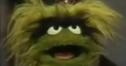 Grundgetta, a whimsical Muppet, showcases her vibrant personality while introducing the letter T.