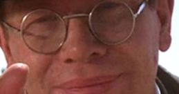 Major Arnold Ernst Toht in a dark hat, glasses, and a sly smile, showcasing his sinister persona from the iconic film.