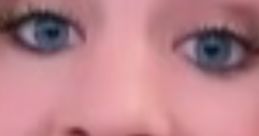 Close-up of a smiling woman with blue eyes, showcasing her expressive features and engaging personality. Perfect for US English content.