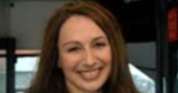 Emma Hignett smiling inside a bus, sharing insights on Ibus announcements and enhancing passenger communication.