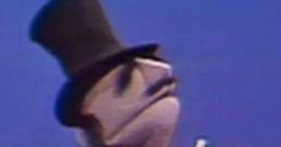 Amazing Mumford, a classic puppet character, in a top hat and cape, holding a magic wand against a blue backdrop.