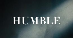 Kendrick Lamar in a dramatic pose, embodying the essence of humility and introspection from the "HUMBLE." video.