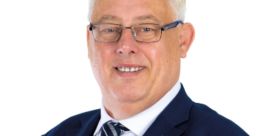 Professional portrait of Thomas Gould, showcasing his expertise in leadership and corporate governance.