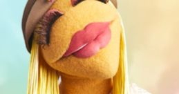 Janice, the whimsical puppet by David Rudman, radiates fun with her vibrant style and colorful accessories.