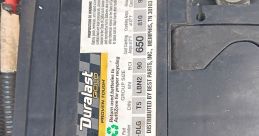 Duralast Gold battery label showing specifications, warnings, and recycling info for optimal performance and safety.
