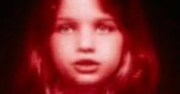 Glowing red visage of the Red Queen from Resident Evil, featuring a child-like figure with a star pendant.
