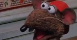 Rizzo the Rat from Muppet fame, wearing a "Pete's" shirt, exudes charm and humor in a playful scene.