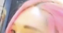 Close-up of a person with pink hair and bold eyeliner, sharing thoughts on "Yummy Yummy Now This" experience.