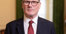 Keir Starmer poses in formal attire, exuding confidence and leadership in a professional setting.
