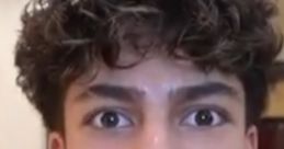 Teen with curly hair showing surprise or concern, possibly related to "King Ferran Form Royalty Family Voice (2025)".