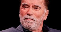 Arnold Schwarzenegger shares insights during an interview, showcasing his iconic presence and charisma in Hollywood.