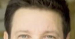 Close-up of Jeremy Renner, showcasing his thoughtful expression and distinctive features in a casual setting.