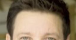 Jeremy Renner speaking directly to the camera, showcasing his signature intense expression in a casual setting.