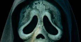 Ghostface character from Scream, featuring a haunting mask and dark cloak, voiced by Carlo Valli in Italian adaptations.