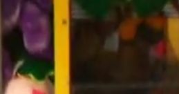 Colorful claw machine featuring plush toys and a vibrant "TRAP DOOR" sign, perfect for fun at Cade's arcade.