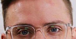 Young man with glasses, focused expression, promoting Mralextech's innovative tech solutions and services.