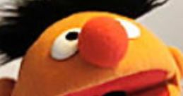 Ernie from Sesame Street shows his playful expression, featuring a bright orange face and classic striped shirt.