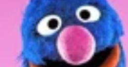 Cheerful Grover from Sesame Street with blue fur, big eyes, and a pink nose, showcasing his playful personality.
